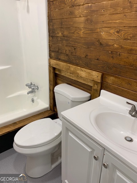 10167 Waterford Road Northeast Covington, GA 30014 - Photo 3 of 20 a white toilet sitting next to a bathroom sink
