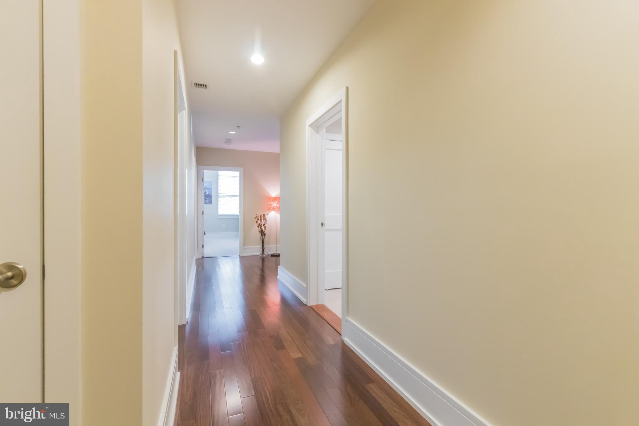 132 Iron Works Way, Unit B Wayne, PA 19087 - Photo 20 of 36 Hallway leading to the Open Floor Plan