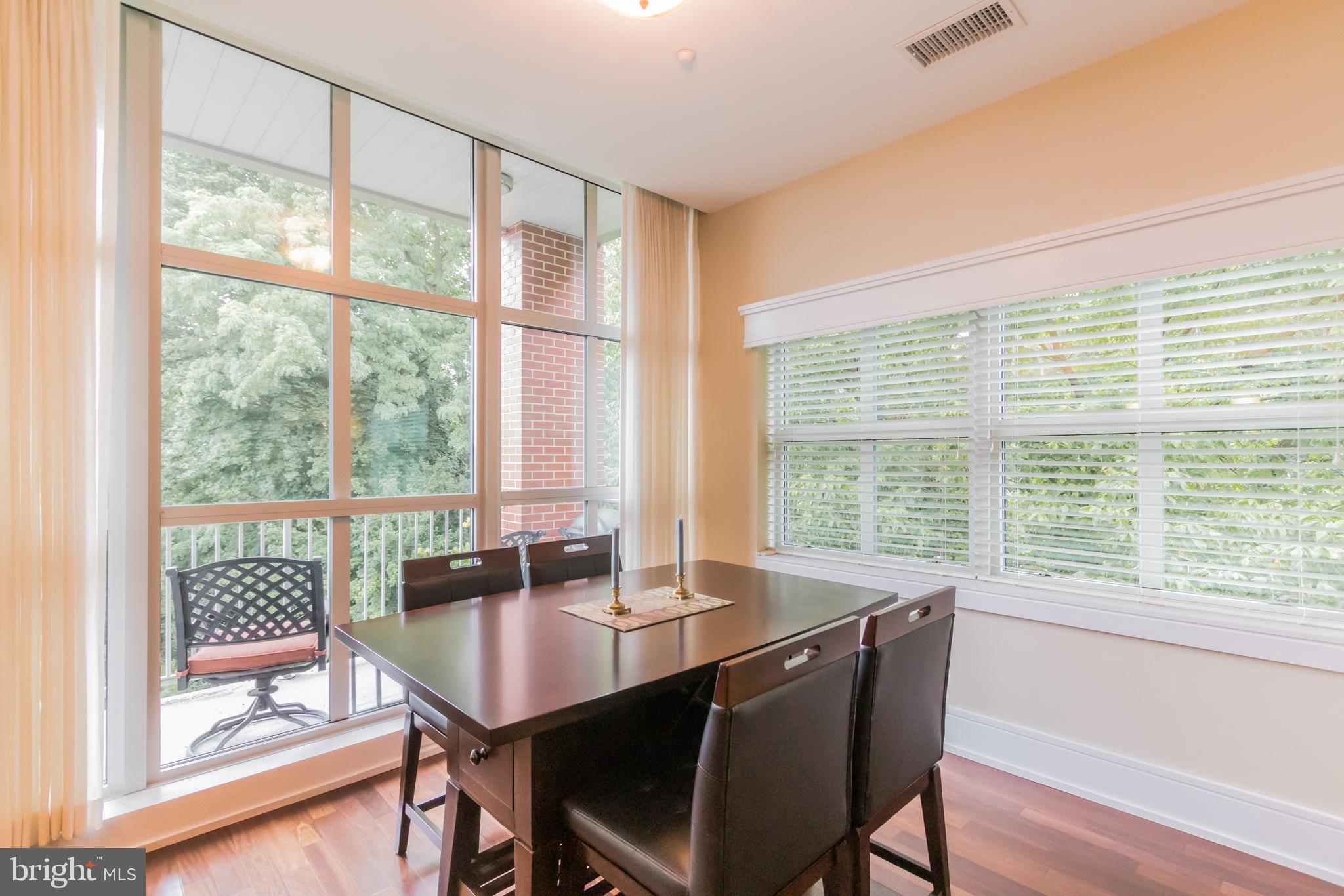 132 Iron Works Way, Unit B Wayne, PA 19087 - Photo 8 of 36 Floor to Ceiling Windows letting in lots of light