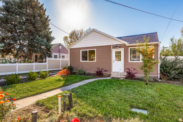 4658 Box Elder Street Salt Lake City, UT 84107 - Photo 1 of 17 Brown siding exterior with white trim and a white paneled entry door