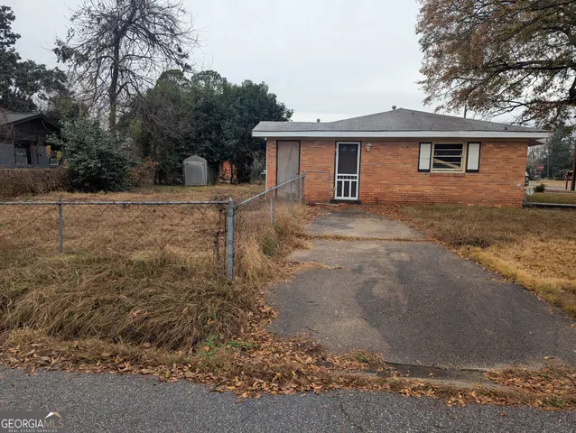 a view of a house with a snow in the yard