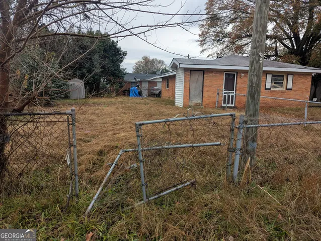 a view of a hallway with a white walls and closet
