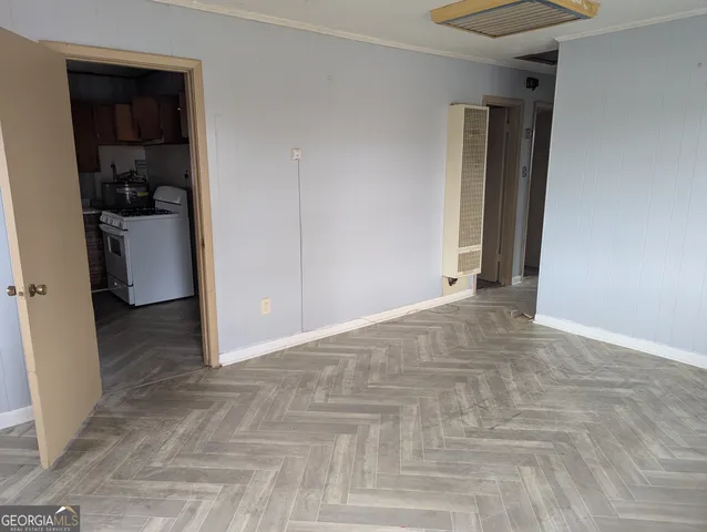 a kitchen with a refrigerator and a stove
