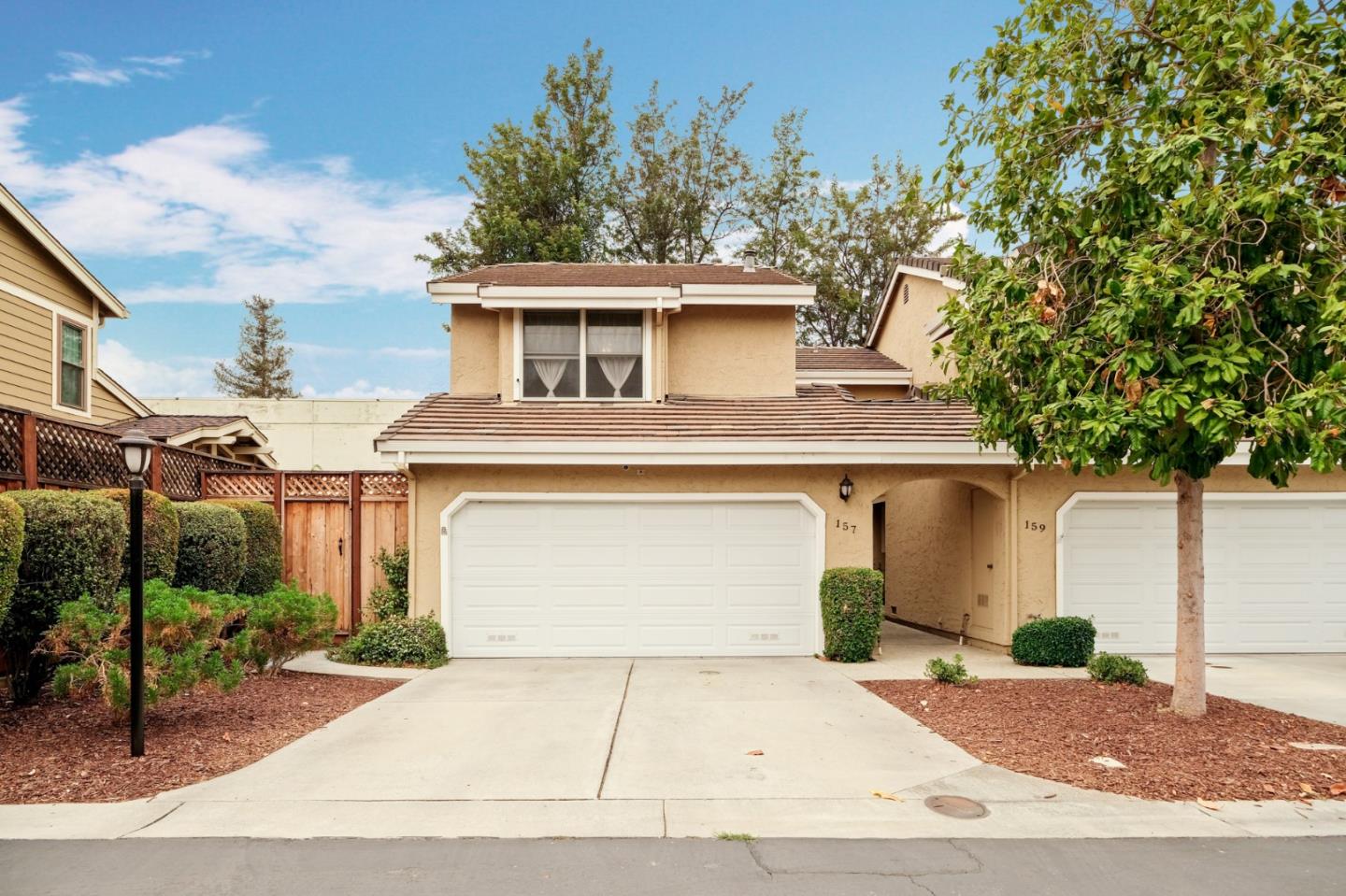 157 Redding Road Campbell, CA 95008 - Photo 1 of 31 a view of a white house with a large tree