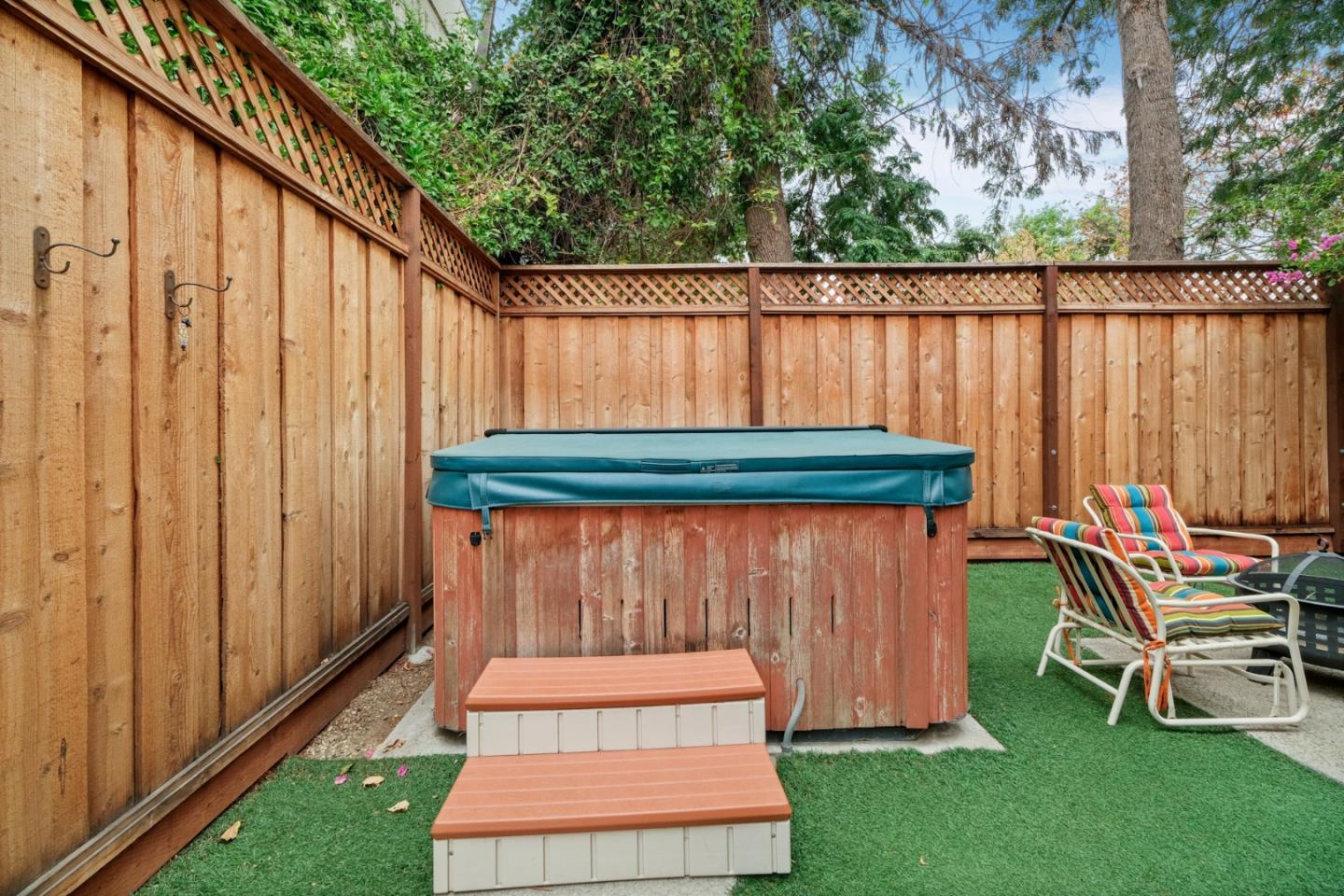 157 Redding Road Campbell, CA 95008 - Photo 19 of 31 a backyard of a house with chairs and a swing