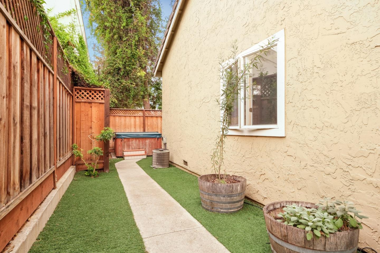 157 Redding Road Campbell, CA 95008 - Photo 22 of 31 a view of a porch with plants and wooden fence