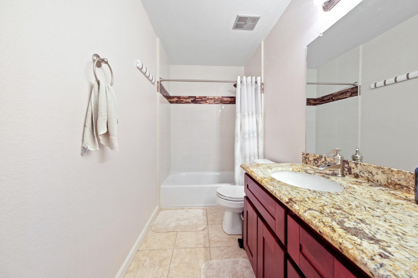 157 Redding Road Campbell, CA 95008 - Photo 26 of 31 a bathroom with a granite countertop sink a toilet and shower