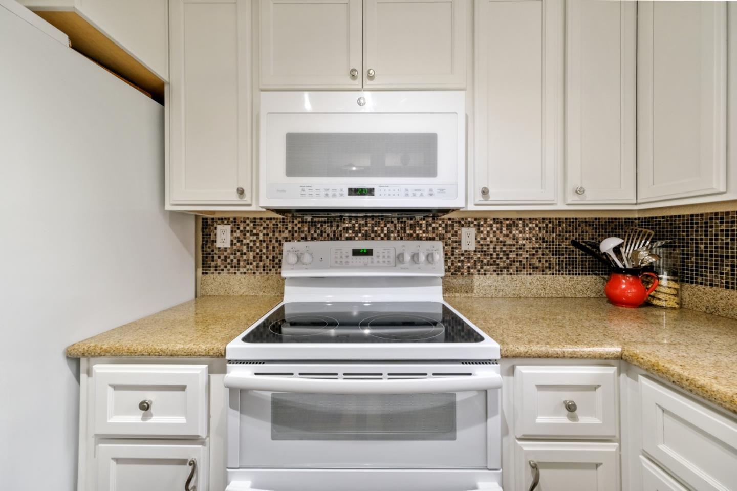 157 Redding Road Campbell, CA 95008 - Photo 5 of 31 a stove top oven sitting inside of a kitchen