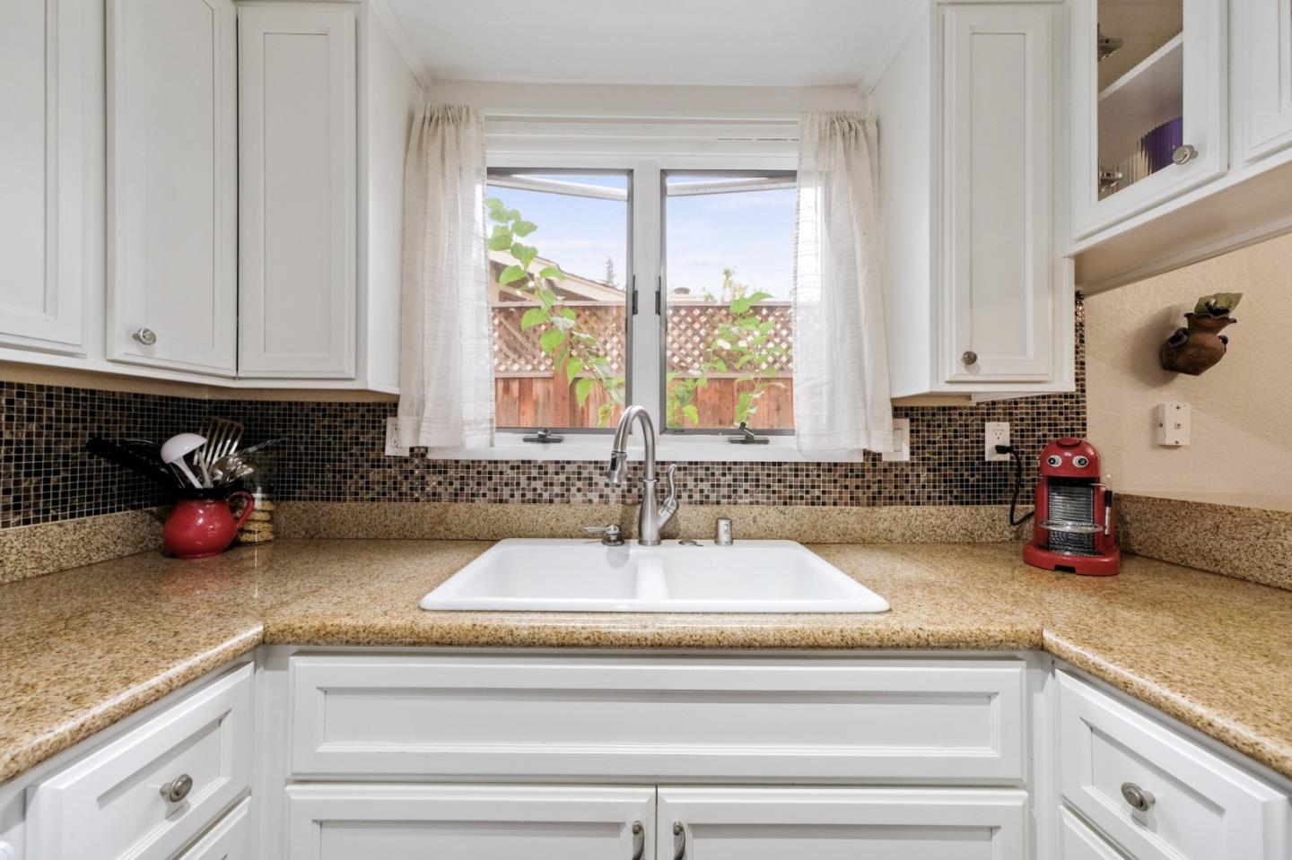 157 Redding Road Campbell, CA 95008 - Photo 6 of 31 a kitchen with a sink and cabinets