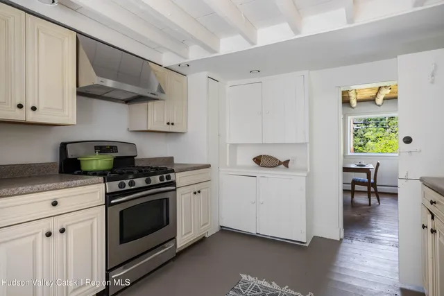 a kitchen with a stove and a refrigerator
