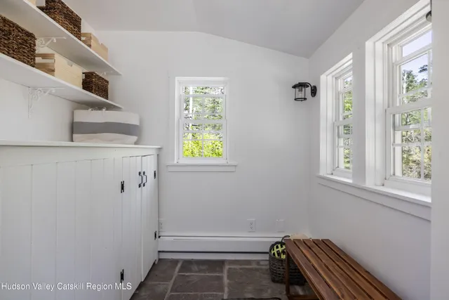 a bathroom with a sink and a window