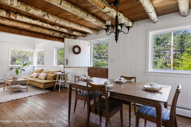 a view of a dining room with furniture window and outside view
