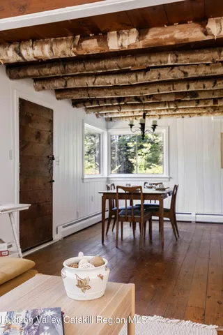 a dining room with a table and chairs