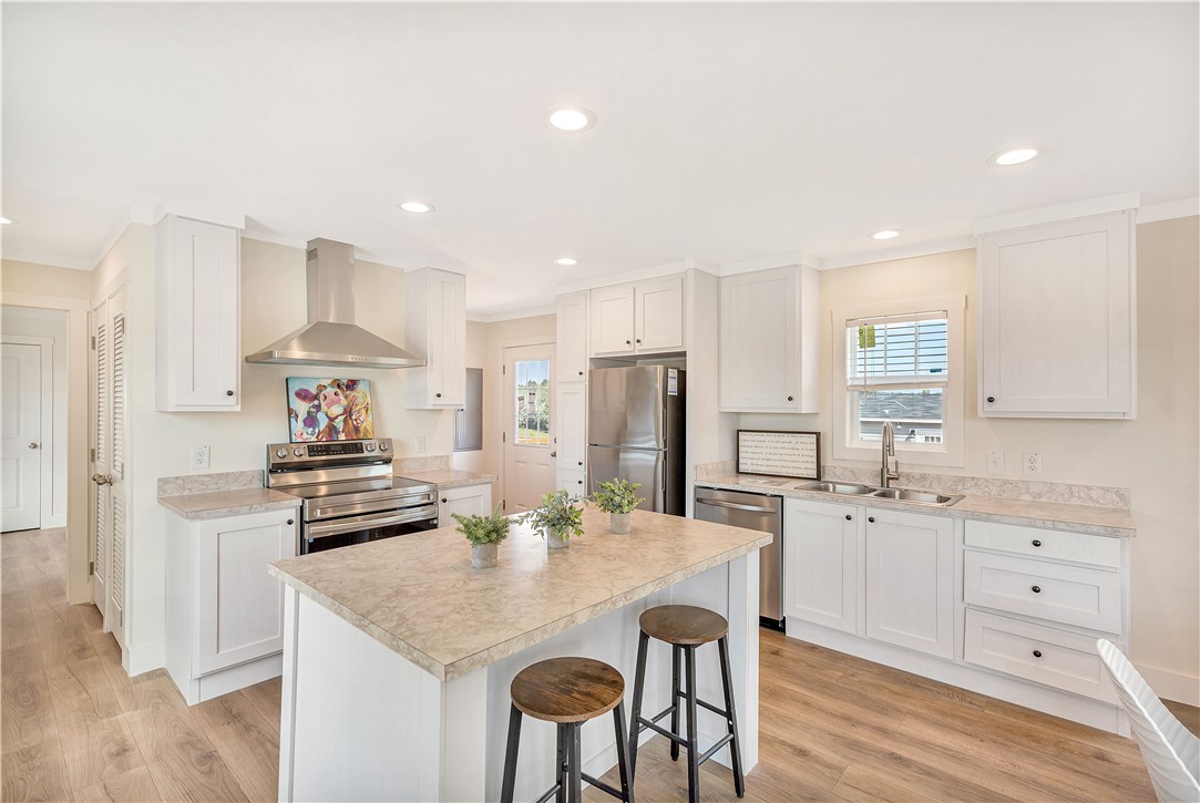 205 Wade Farm Road Fair Play, SC 29643 - Photo 11 of 23 Modern recessed lighting illuminates a spacious central island and classic cabinetry.