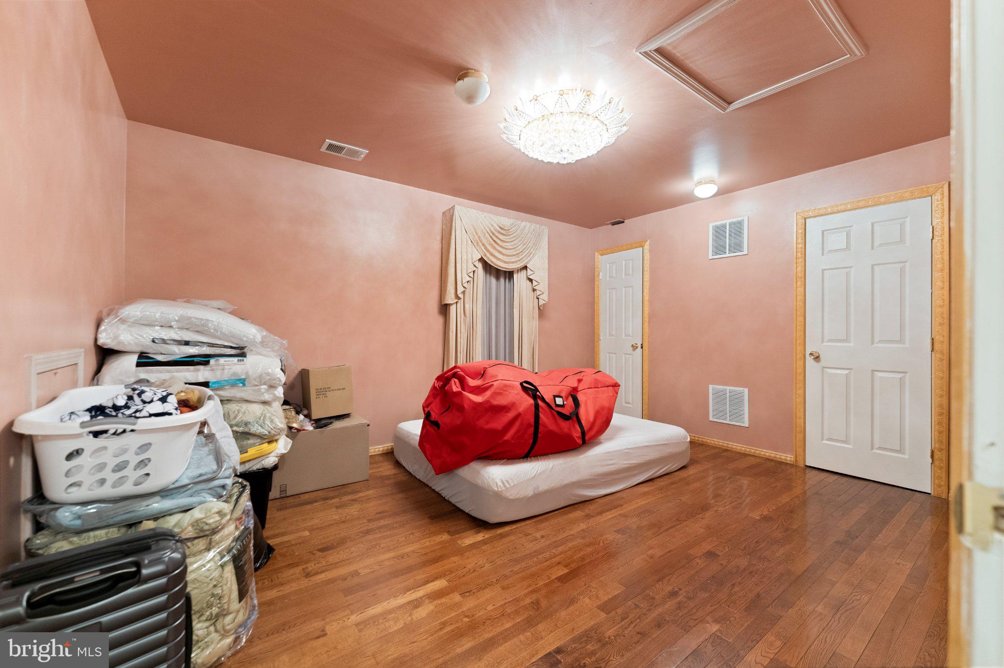 7 Spring Drive Dayton, NJ 08810 - Photo 14 of 24 a bedroom with a bed and a chandelier