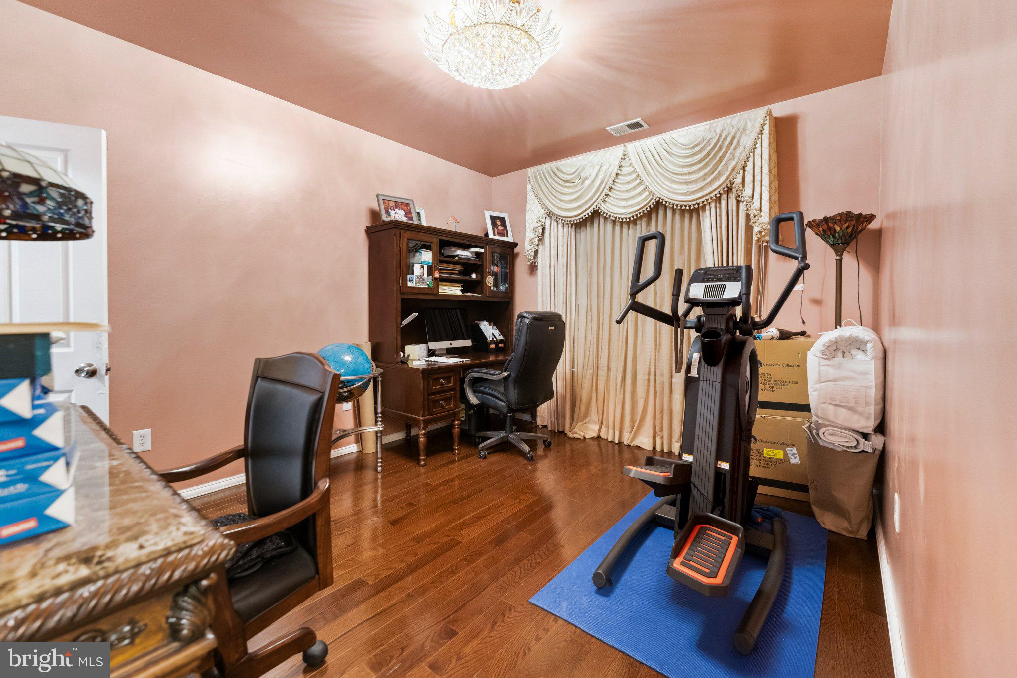 7 Spring Drive Dayton, NJ 08810 - Photo 15 of 24 a view of a room with gym equipment