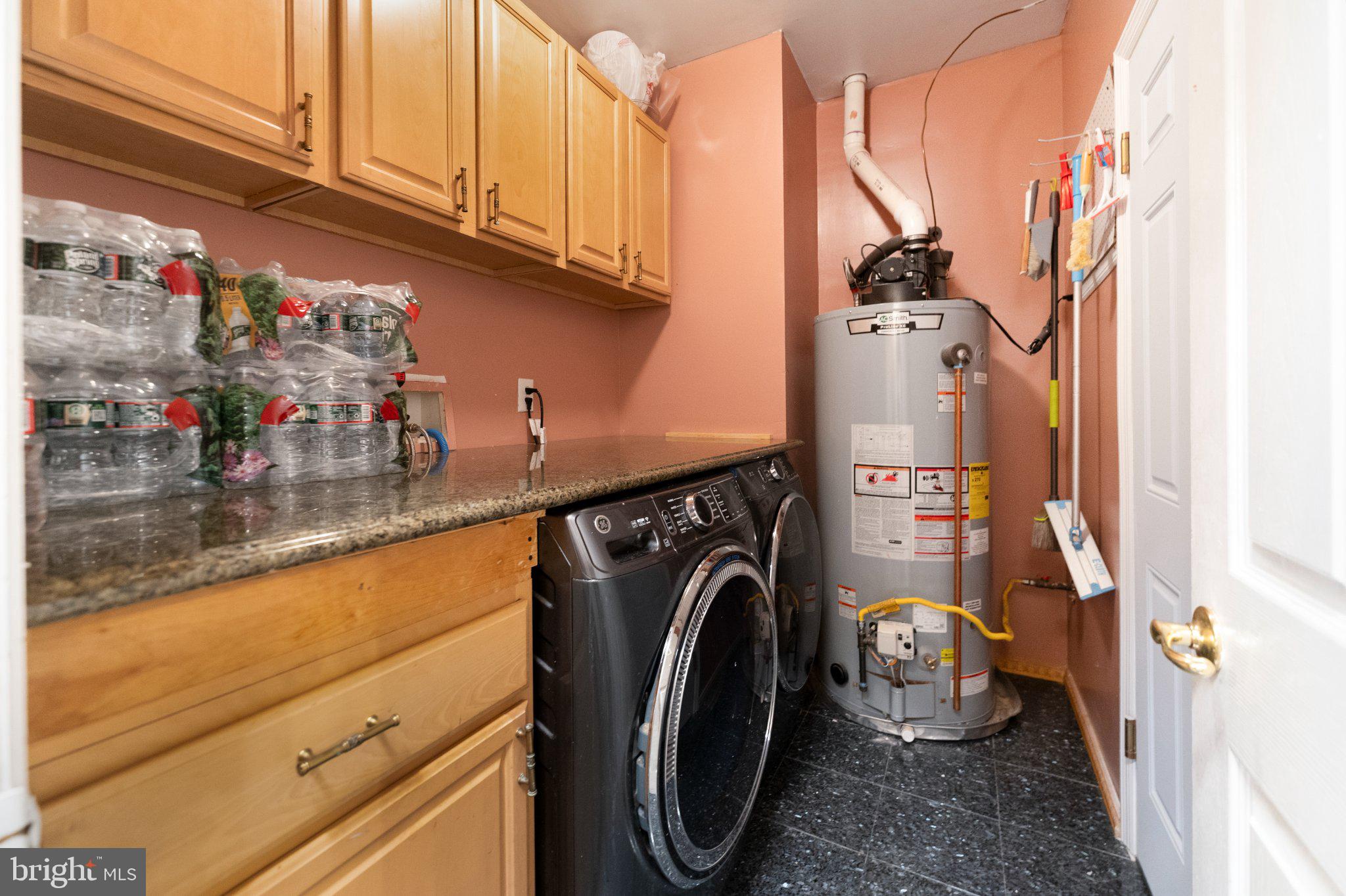 7 Spring Drive Dayton, NJ 08810 - Photo 16 of 24 a utility room with dryer and washer