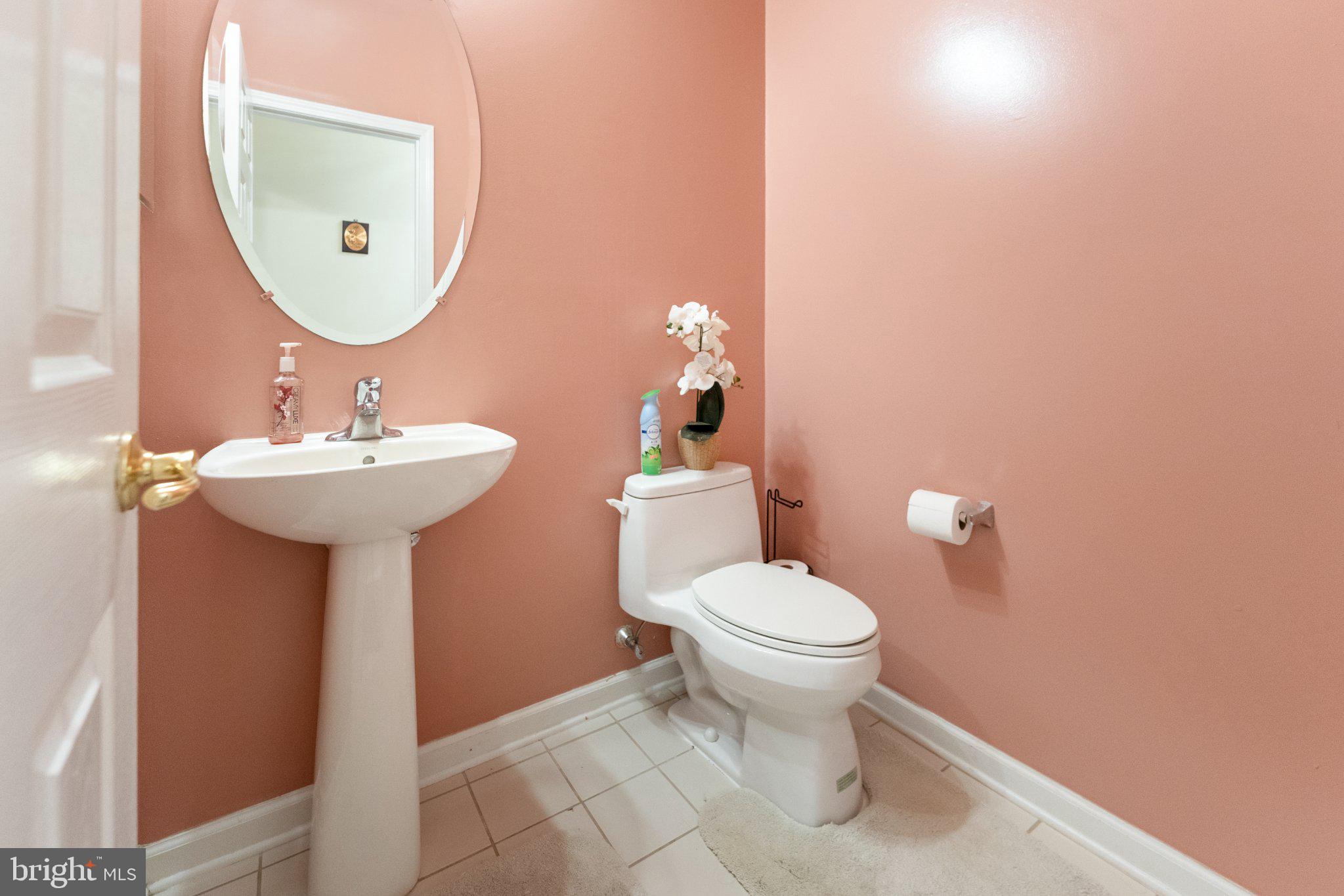7 Spring Drive Dayton, NJ 08810 - Photo 18 of 24 a bathroom with a sink a mirror and toilet