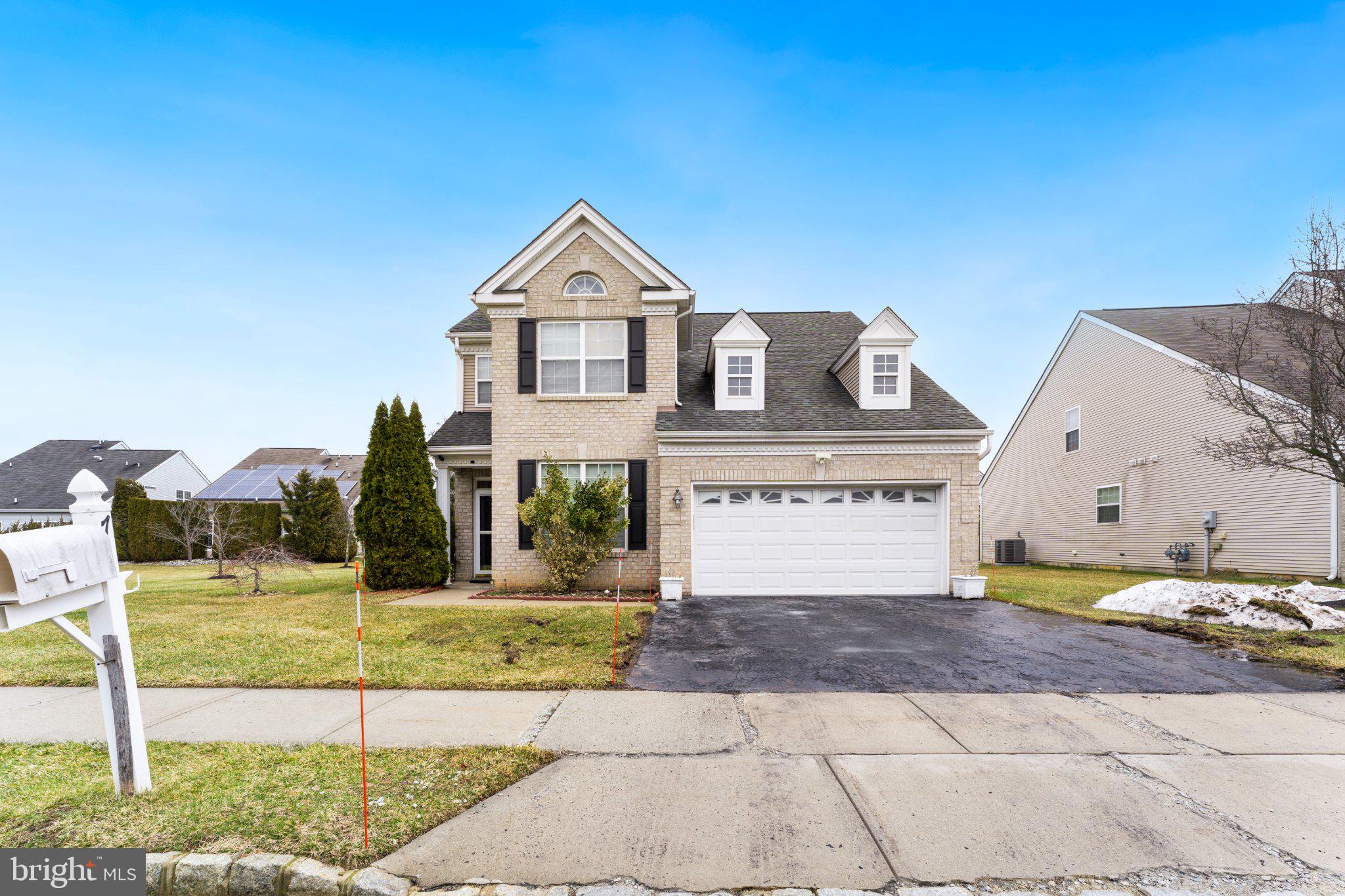 7 Spring Drive Dayton, NJ 08810 - Photo 2 of 24 a front view of a house with a yard