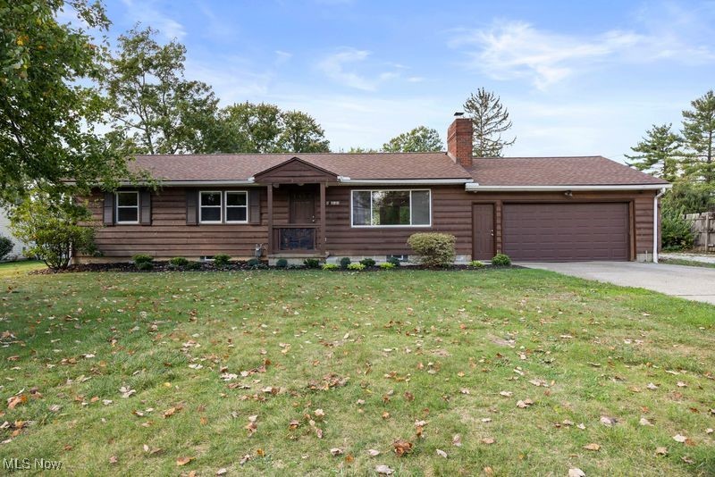 5956 Ryan Road Medina, OH 44256 - Photo 1 of 27 Single story home featuring a front yard, a garage, driveway, and a chimney