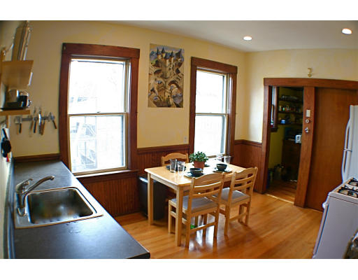 89 Montebello Road, Unit 3 Boston, MA 02130 - Photo 1 of 9 a kitchen with a sink stove and a refrigerator