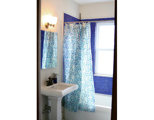 89 Montebello Road, Unit 3 Boston, MA 02130 - Photo 6 of 9 a bathroom with a sink and mirror