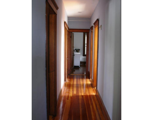 89 Montebello Road, Unit 3 Boston, MA 02130 - Photo 9 of 9 a view of a hallway with wooden floor