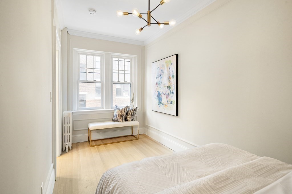 4 Chiswick Road, Unit 34 Boston, MA 02135 - Photo 14 of 22 a spacious bedroom with a bed and a window