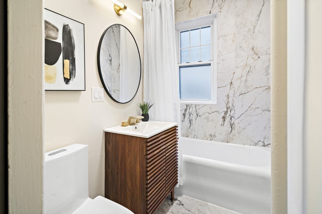 4 Chiswick Road, Unit 34 Boston, MA 02135 - Photo 16 of 22 a bathroom with a sink toilet and a bathtub