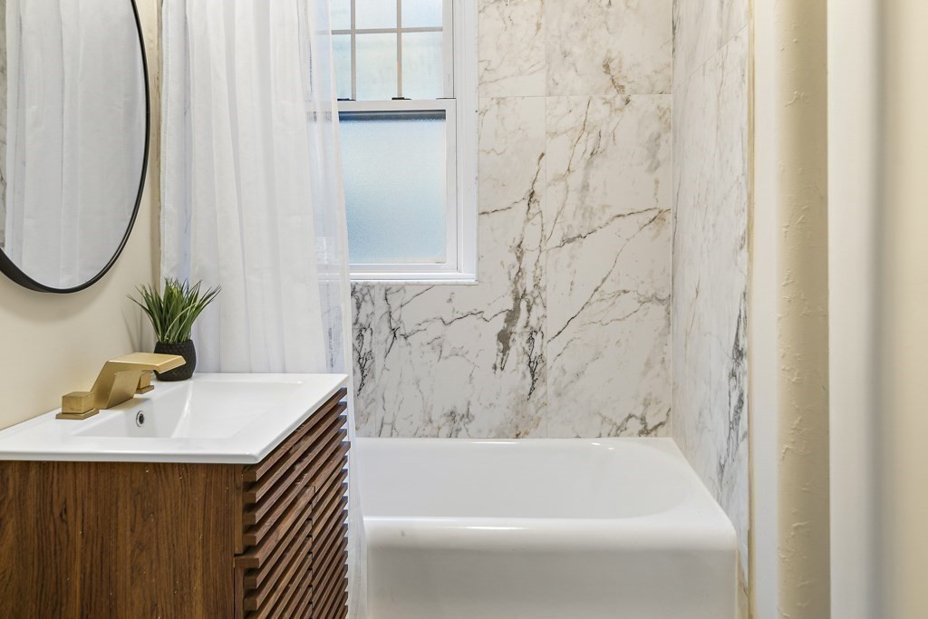 4 Chiswick Road, Unit 34 Boston, MA 02135 - Photo 17 of 22 a bathroom with a sink and a mirror