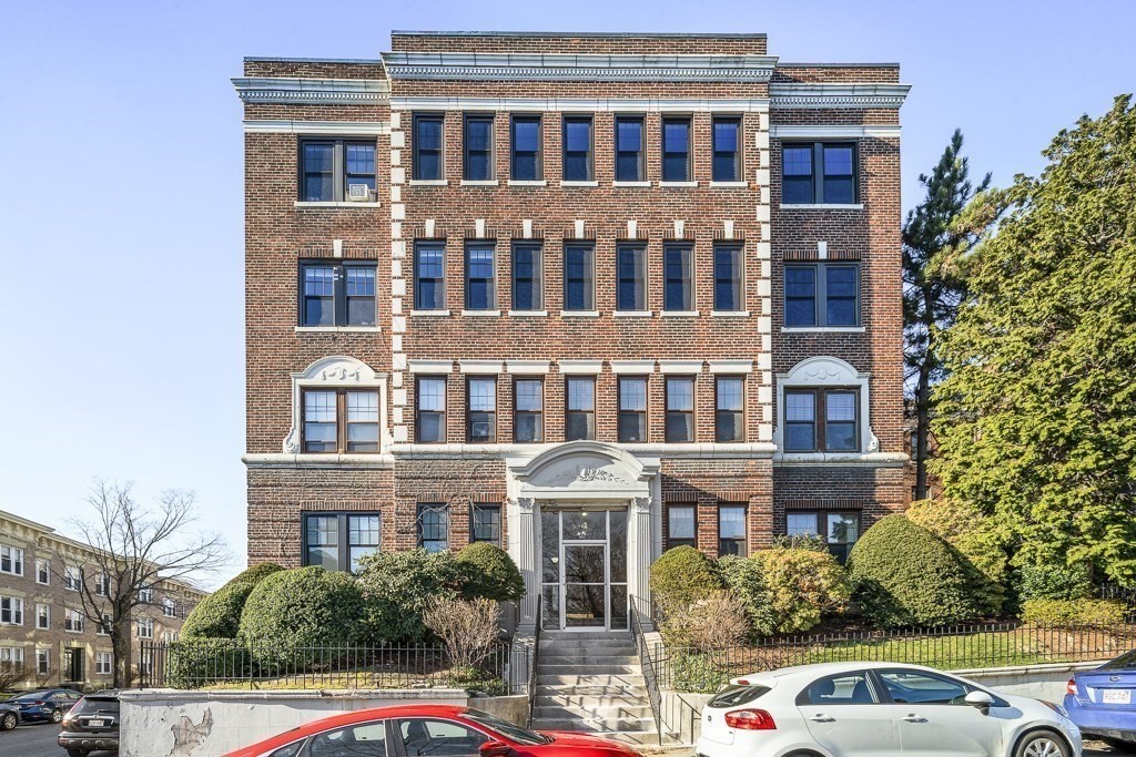 4 Chiswick Road, Unit 34 Boston, MA 02135 - Photo 22 of 22 a front view of a residential apartment building with a yard