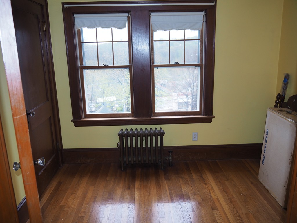 3 Argyle Road Arlington, MA 02476 - Photo 11 of 13 an empty room with wooden floor and windows
