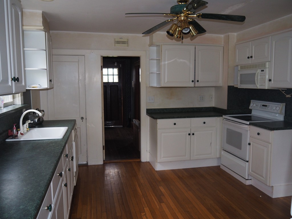 3 Argyle Road Arlington, MA 02476 - Photo 3 of 13 a kitchen with a sink cabinets and wooden floor