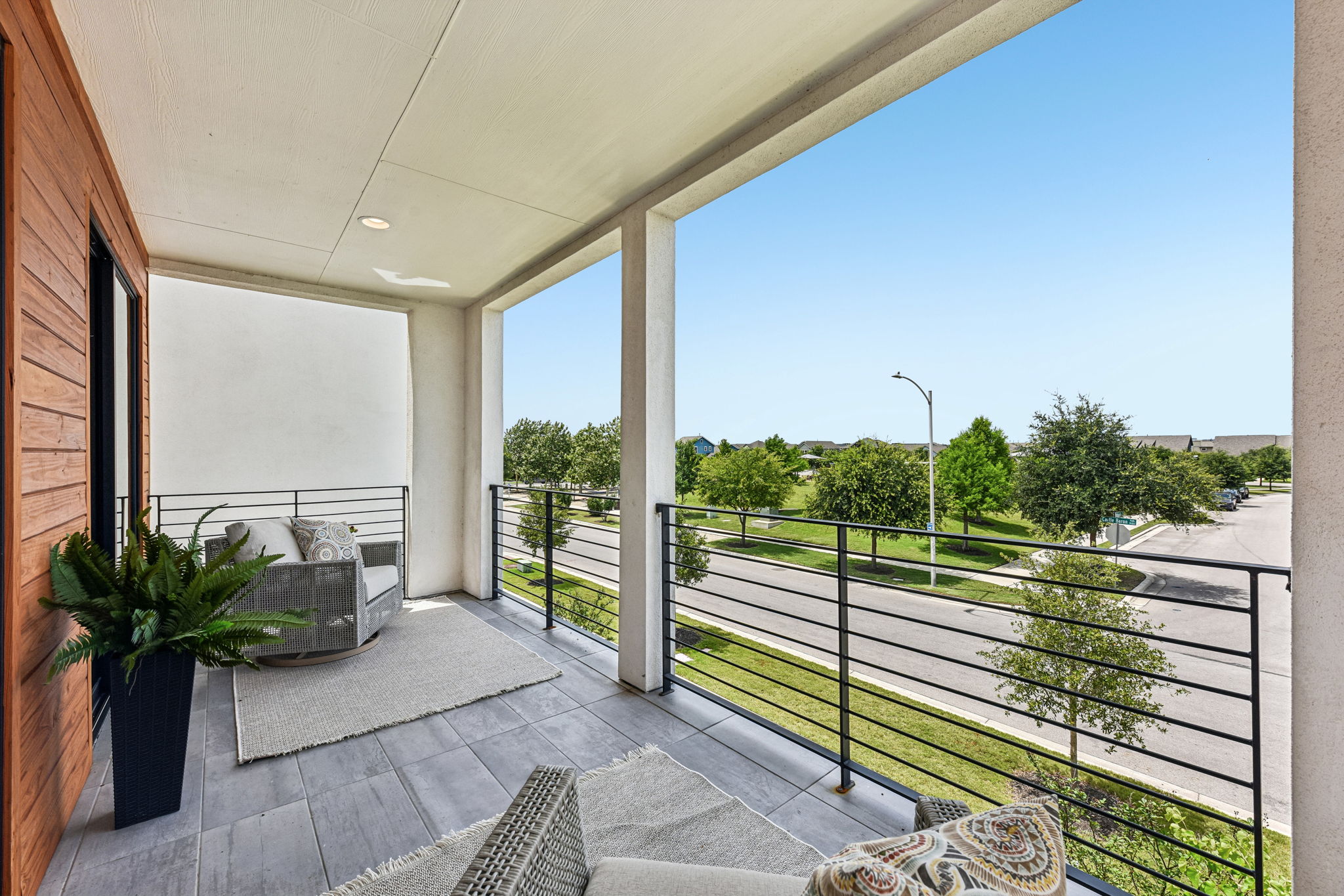 9101 Cattle Baron Path Austin, TX 78747 - Photo 35 of 40 Enjoy quiet moments and expansive views from this balcony, an ideal spot for morning coffee or evening relaxation.