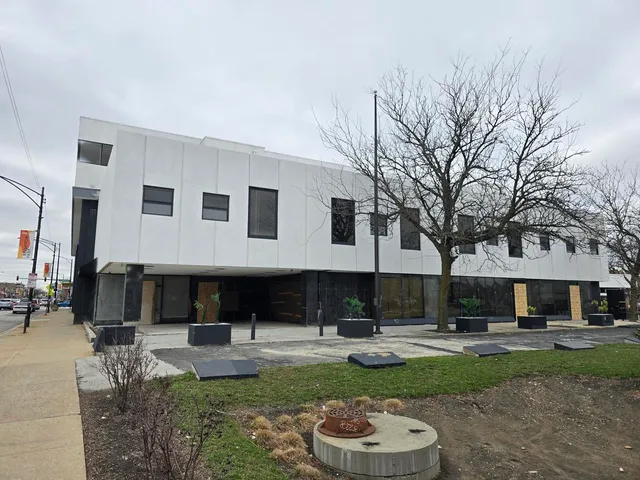 a view of a yard with furniture and a tree