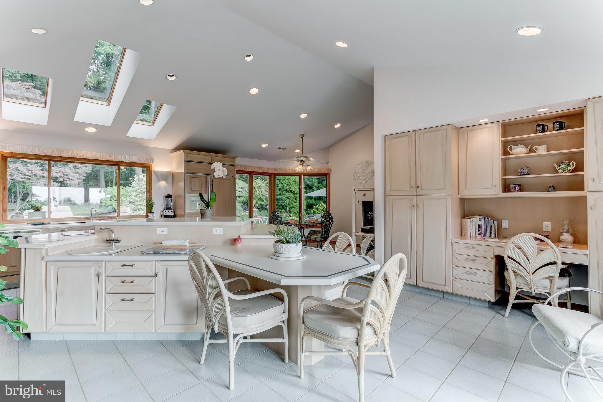 16524 York Road Monkton, MD 21111 - Photo 16 of 33 a kitchen with stainless steel appliances kitchen island granite countertop a table and chairs in it