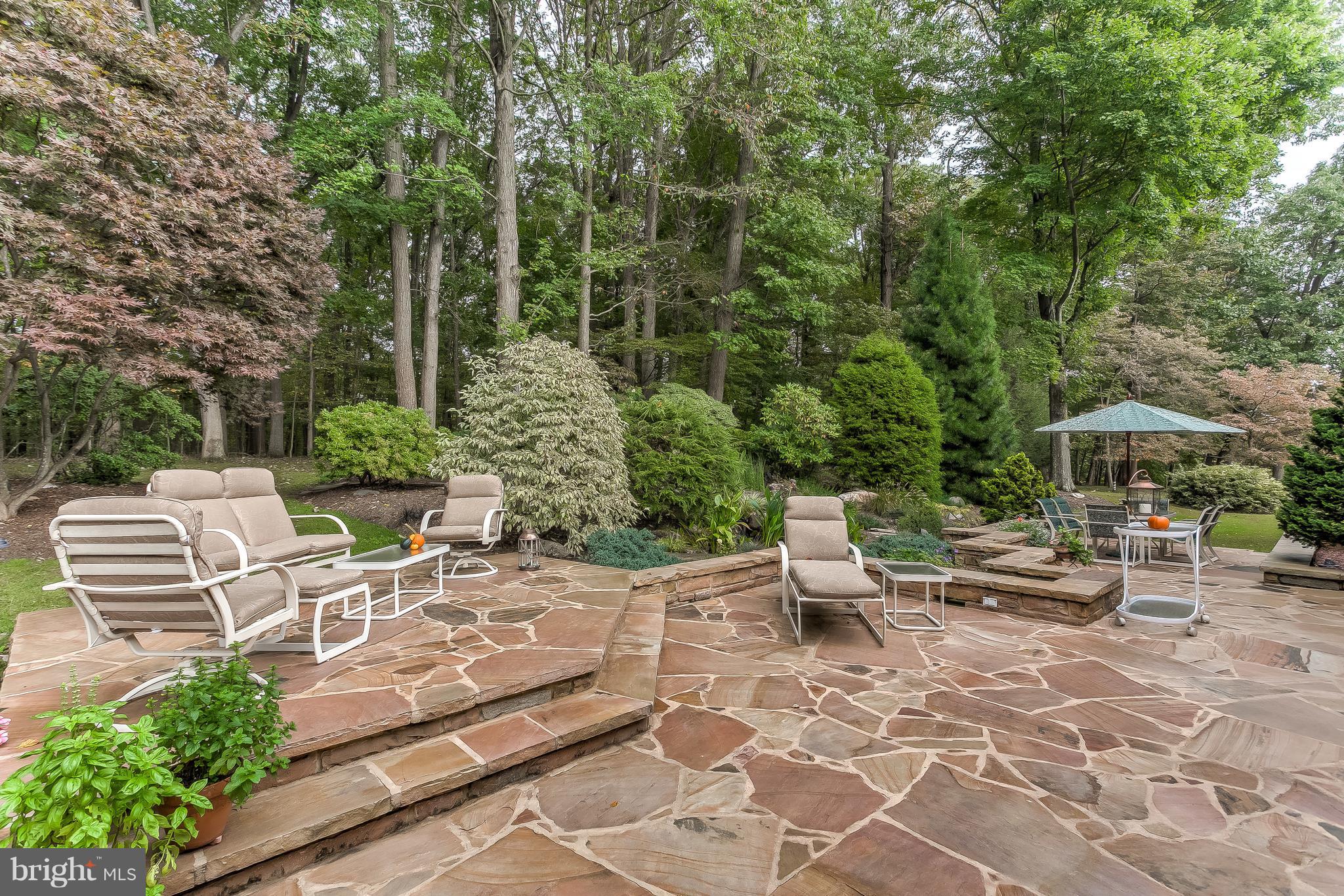 16524 York Road Monkton, MD 21111 - Photo 29 of 33 a view of a patio with chairs and table under an umbrella