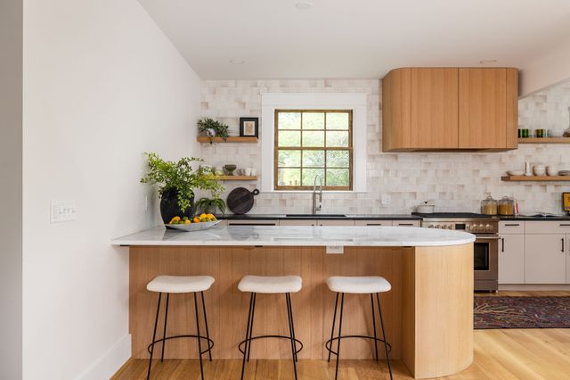 a bathroom with a granite countertop shower a sink and a mirror
