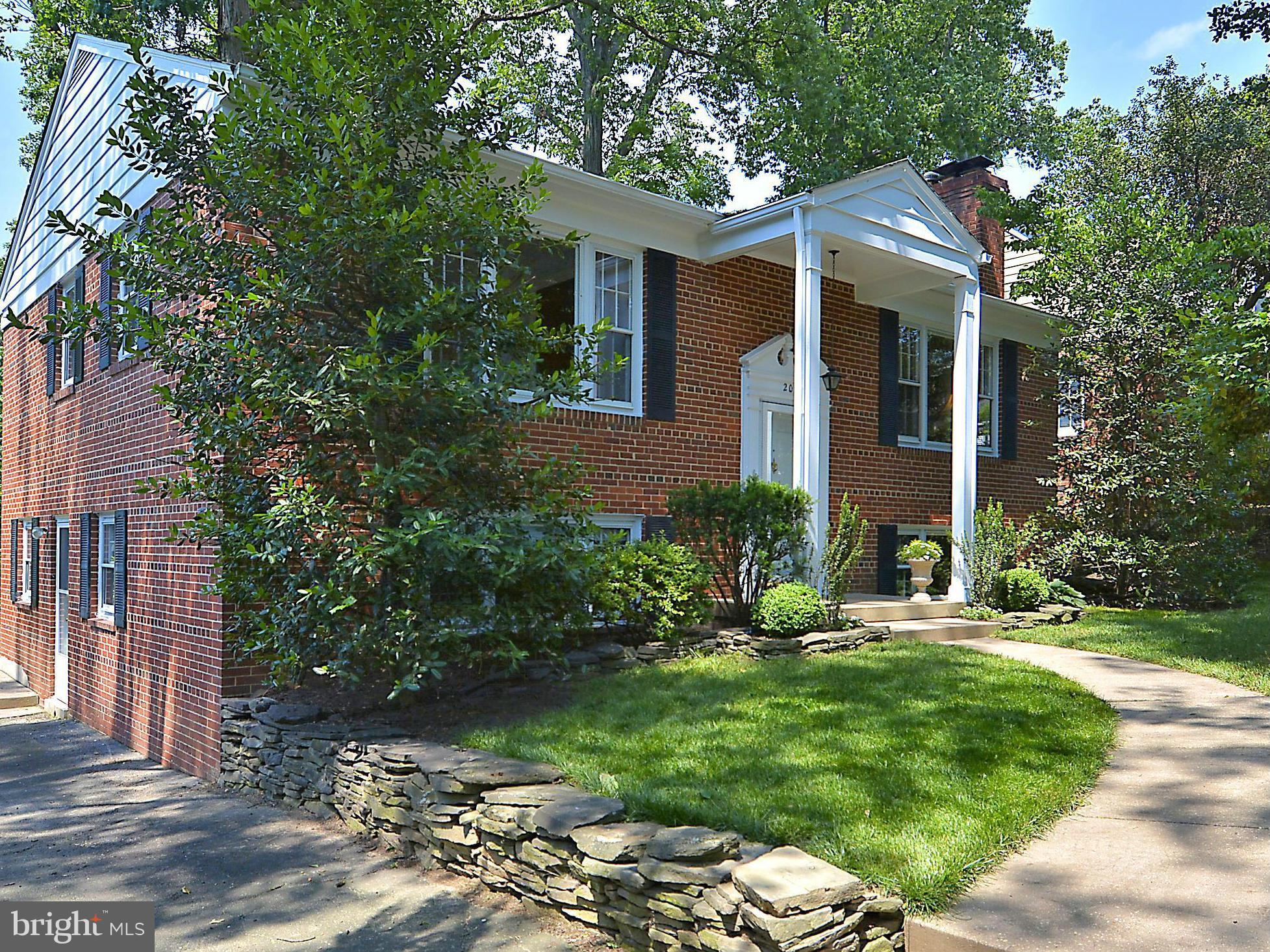 209 MacArthur Road Alexandria, VA 22305 - Photo 1 of 26 a view of a house with a yard and sitting area