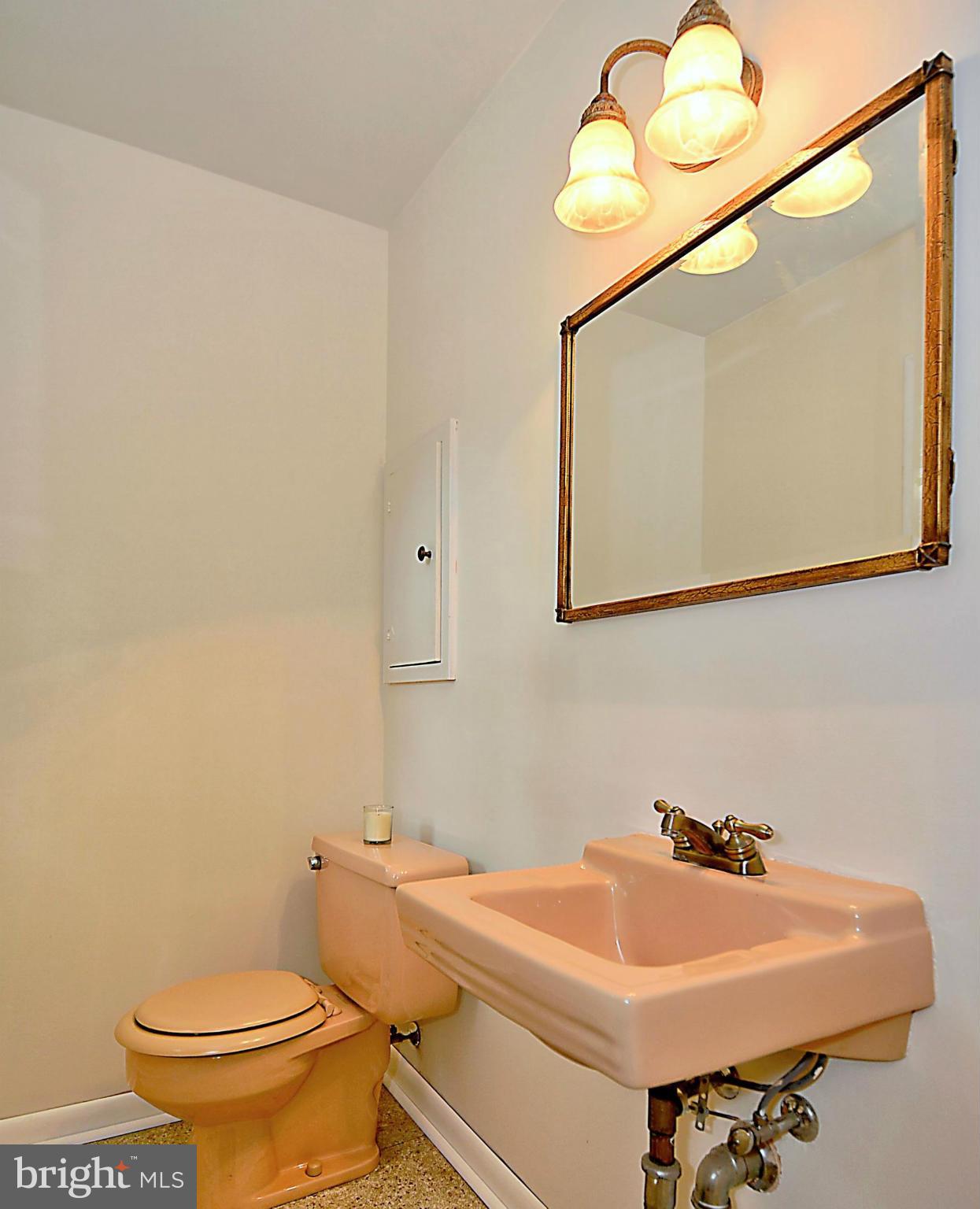 209 MacArthur Road Alexandria, VA 22305 - Photo 12 of 26 a bathroom with a sink and a toilet