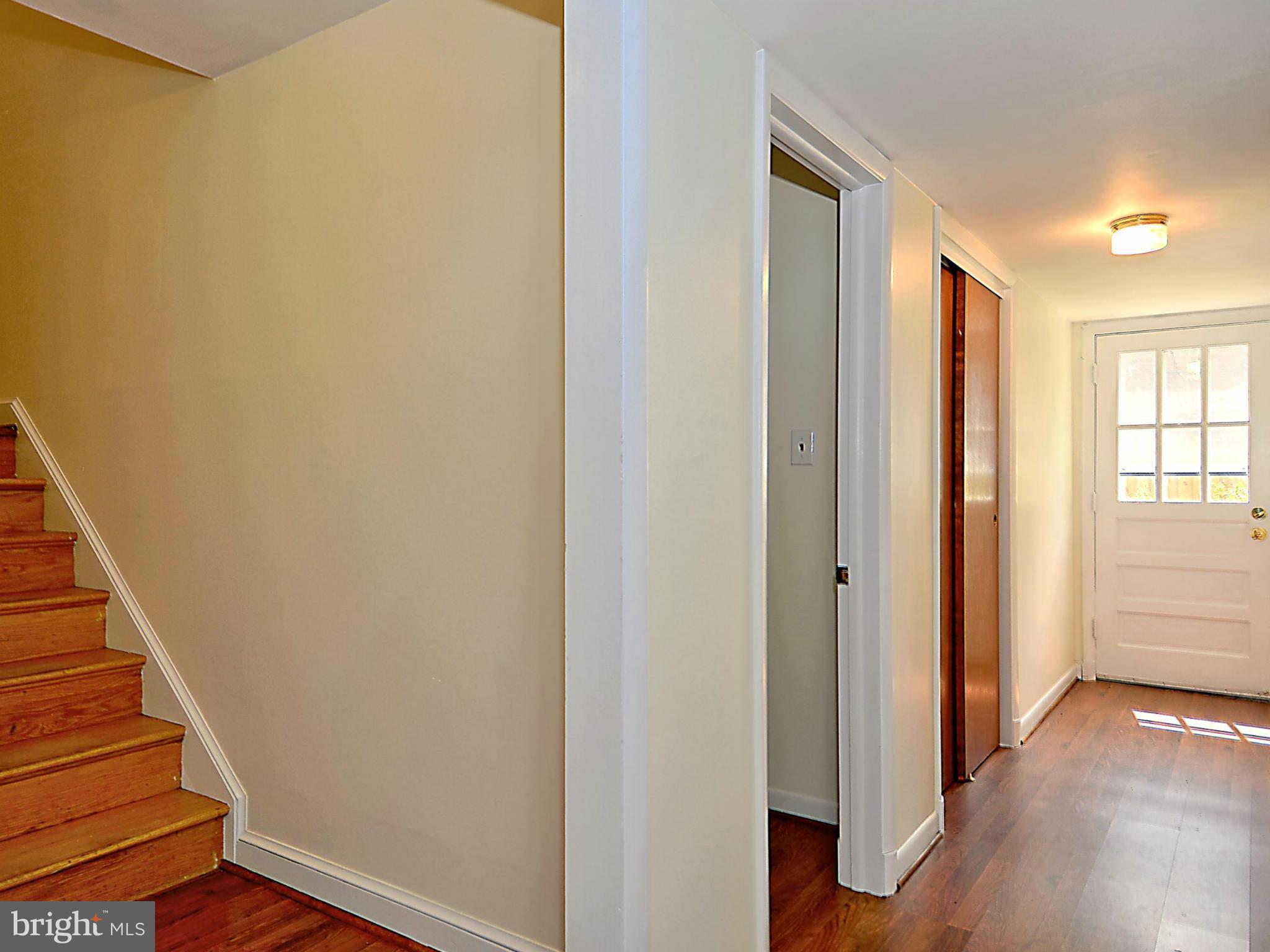 209 MacArthur Road Alexandria, VA 22305 - Photo 16 of 26 a view of a hallway with wooden floor and entryway
