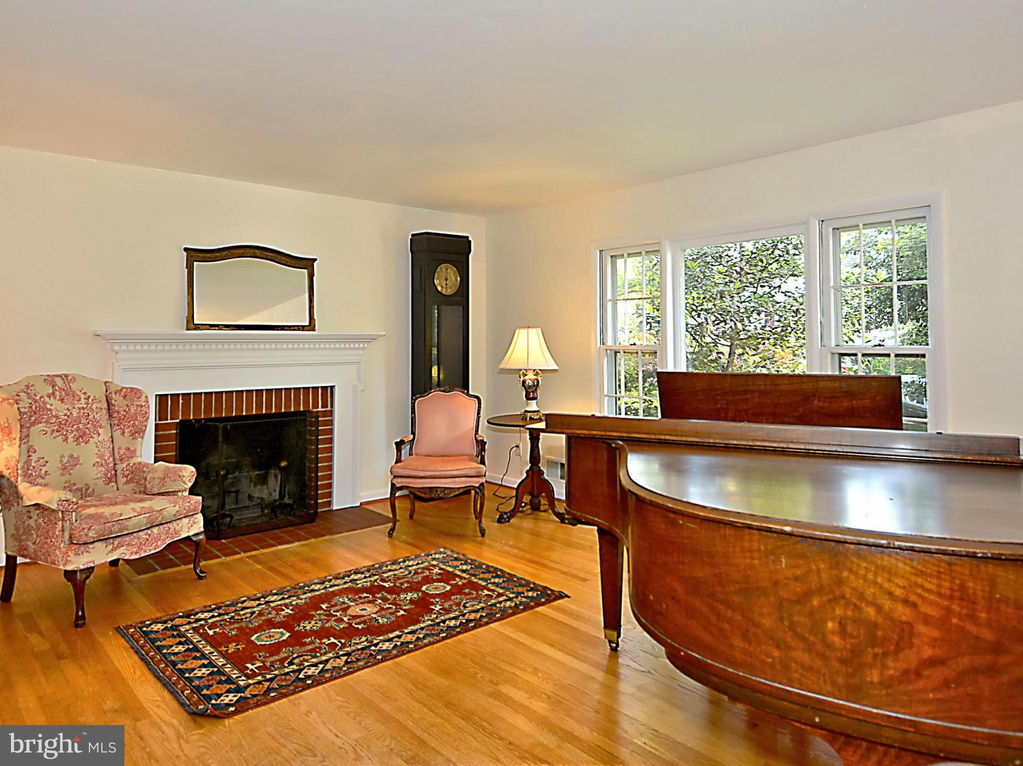 209 MacArthur Road Alexandria, VA 22305 - Photo 3 of 26 a living room with furniture rug and window