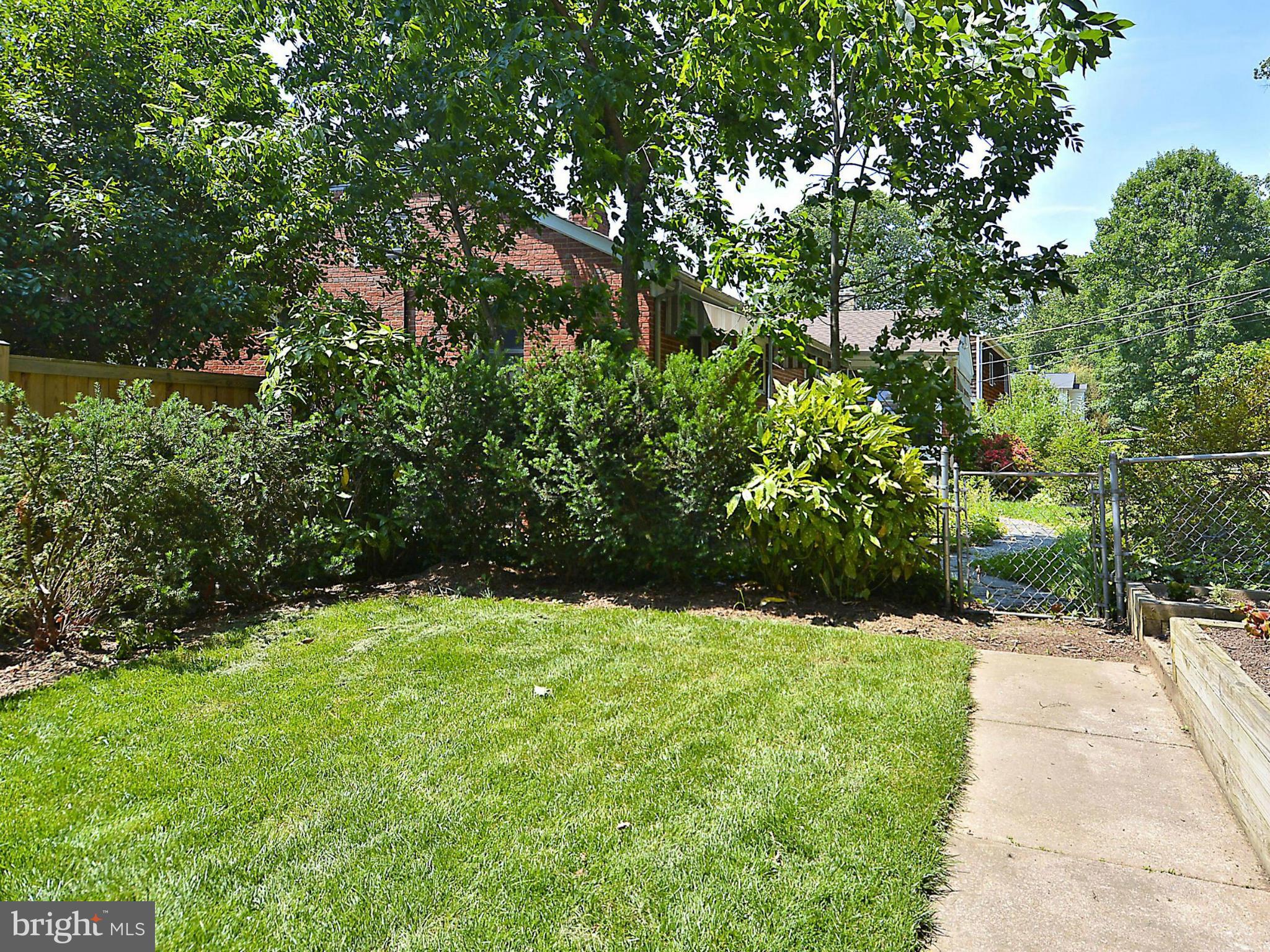 209 MacArthur Road Alexandria, VA 22305 - Photo 25 of 26 a view of an outdoor space and a yard