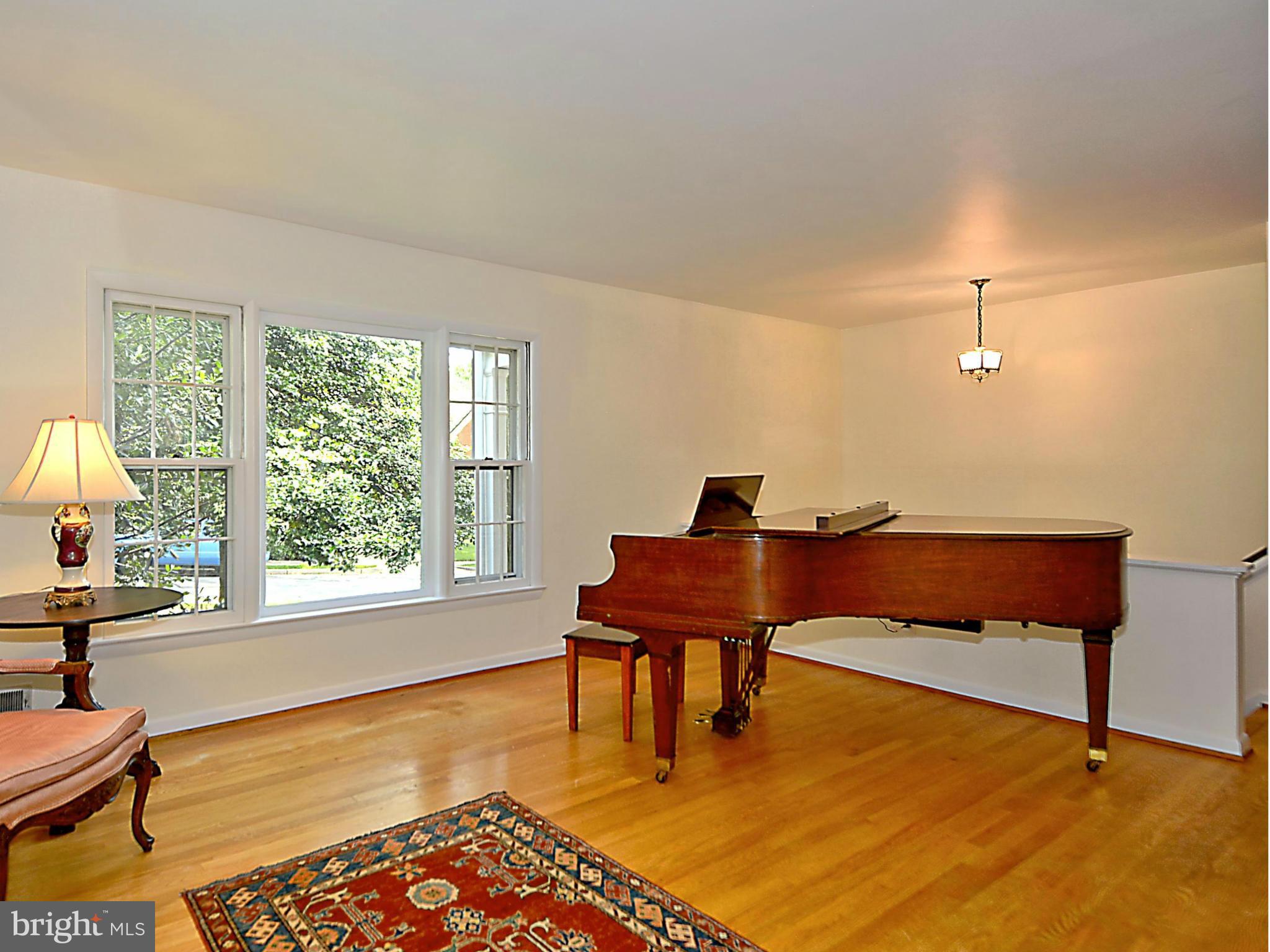 209 MacArthur Road Alexandria, VA 22305 - Photo 4 of 26 a living room with furniture and a window