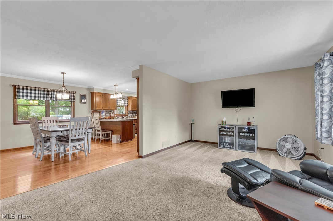 408 River Road Canal Fulton, OH 44614 - Photo 19 of 42 Open-concept living space featuring carpeted flooring and neutral wall tones