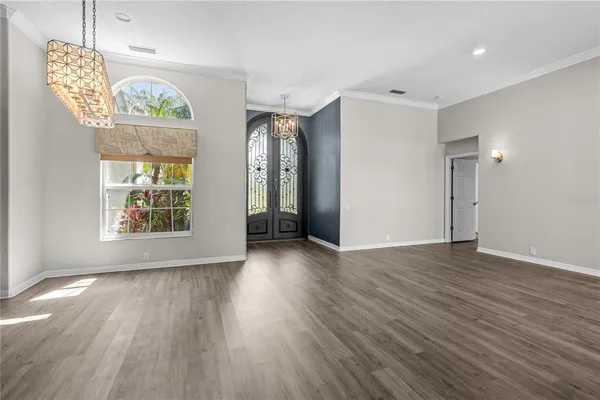 a view of a livingroom with an empty space and a window