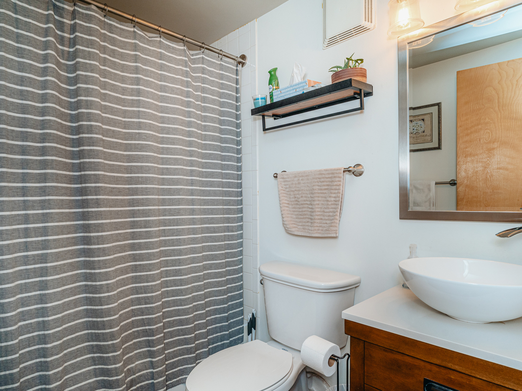 1727 South Indiana Avenue, Unit 324 Chicago, IL 60616 - Photo 18 of 35 a white toilet sitting next to a white wall