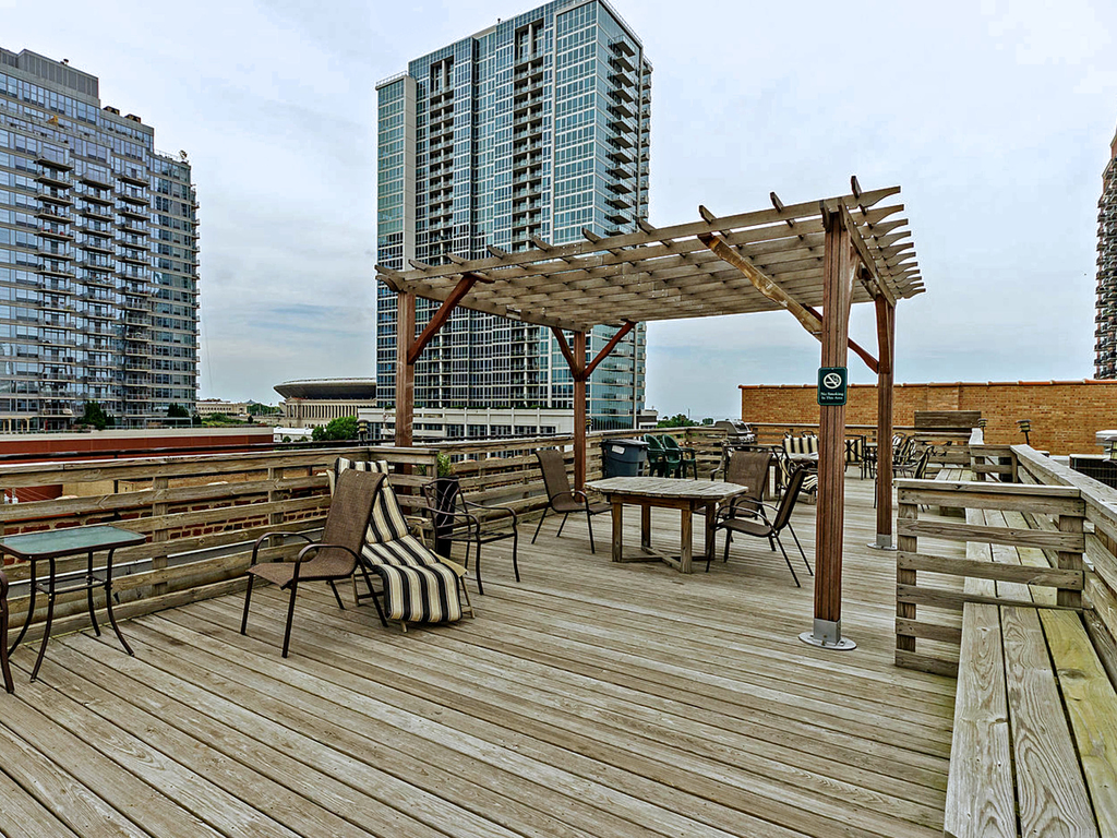1727 South Indiana Avenue, Unit 324 Chicago, IL 60616 - Photo 25 of 35 a view of balcony and chairs with wooden floor