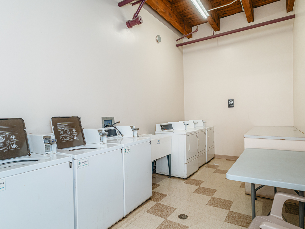 1727 South Indiana Avenue, Unit 324 Chicago, IL 60616 - Photo 29 of 35 a utility room with dryer and washer