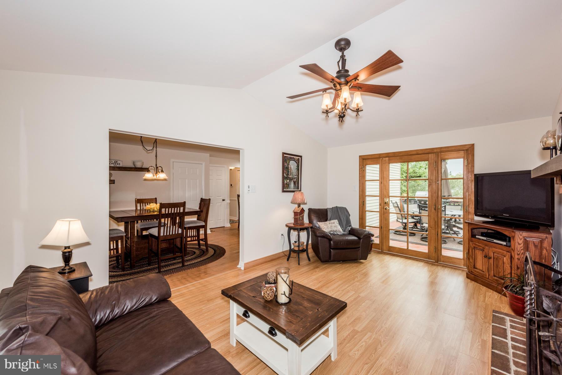 6032 Bakers Place Hanover, MD 21076 - Photo 11 of 30 a living room with furniture and a flat screen tv with wooden floor